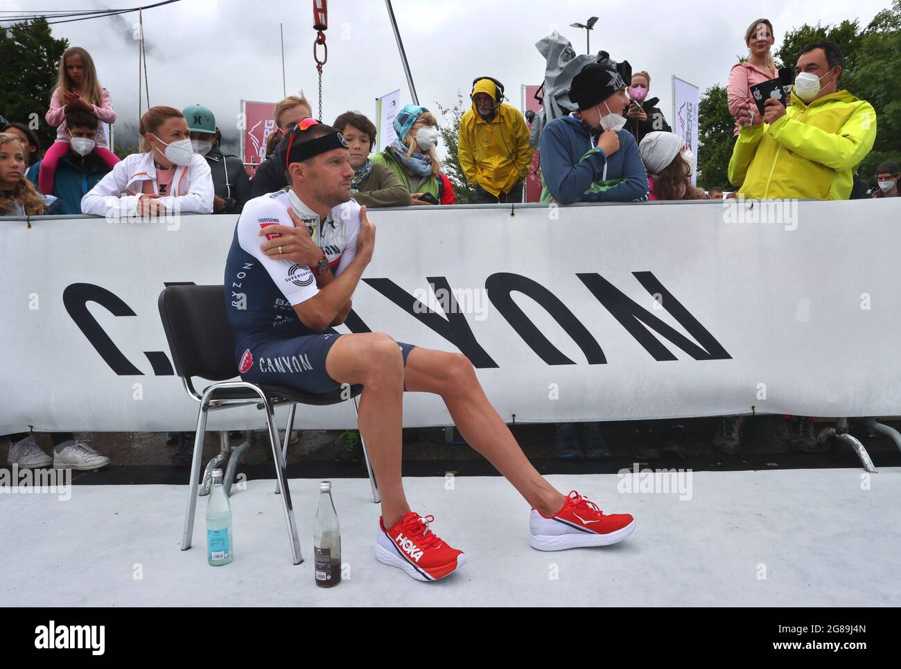 Immenstadt, Germany. 18th July, 2021. Jan Frodeno, triathlete from Germany,  sits at the Tri Battle Royal, freezing at the finish line. Credit:  Karl-Josef Hildenbrand/dpa/Alamy Live News Stock Photo - Alamy