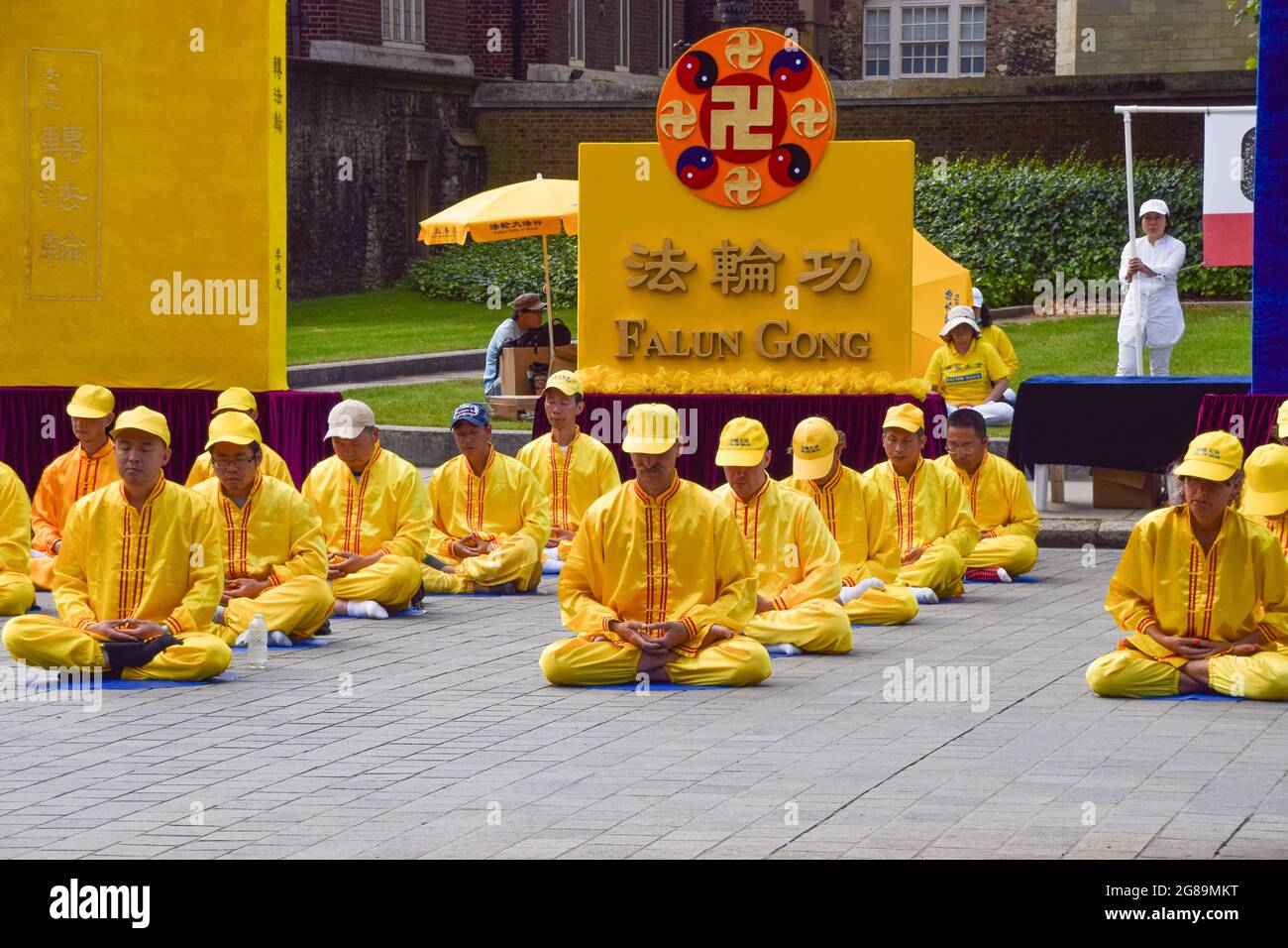 London, United Kingdom. 18th July 2021. Falun Gong practitioners and supporters gathered outside the Houses of Parliament to protest against the Chinese government's persecution, according to the protesters, of Falun Gong (also known as Falun Dafa) meditation practitioners, through abductions, imprisonment, torture, and organ harvesting. (Credit: Vuk Valcic / Alamy Live News) Stock Photo