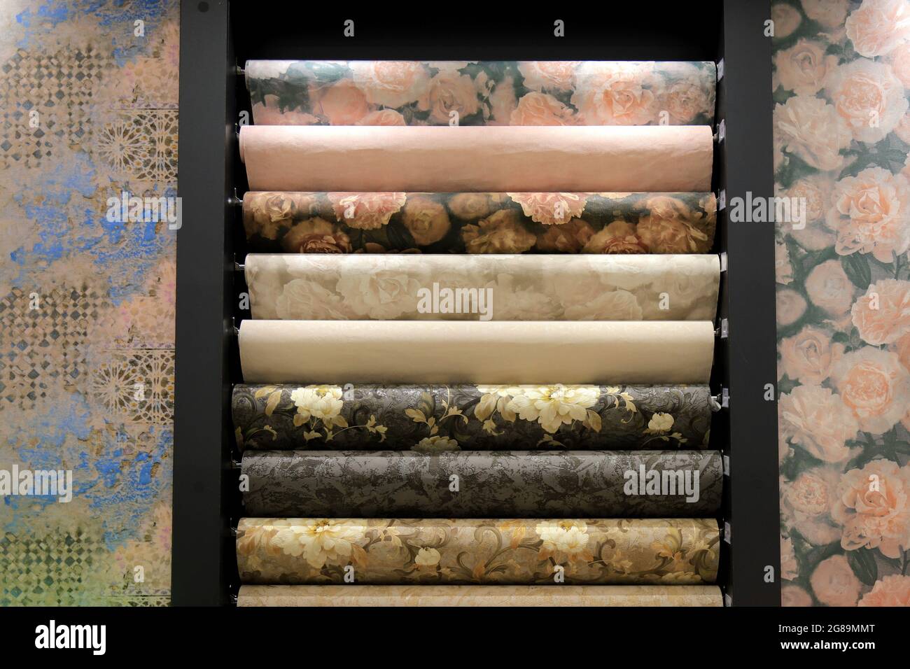 Rolls of vinyl wallpaper. Various textures and colors of paper for wall