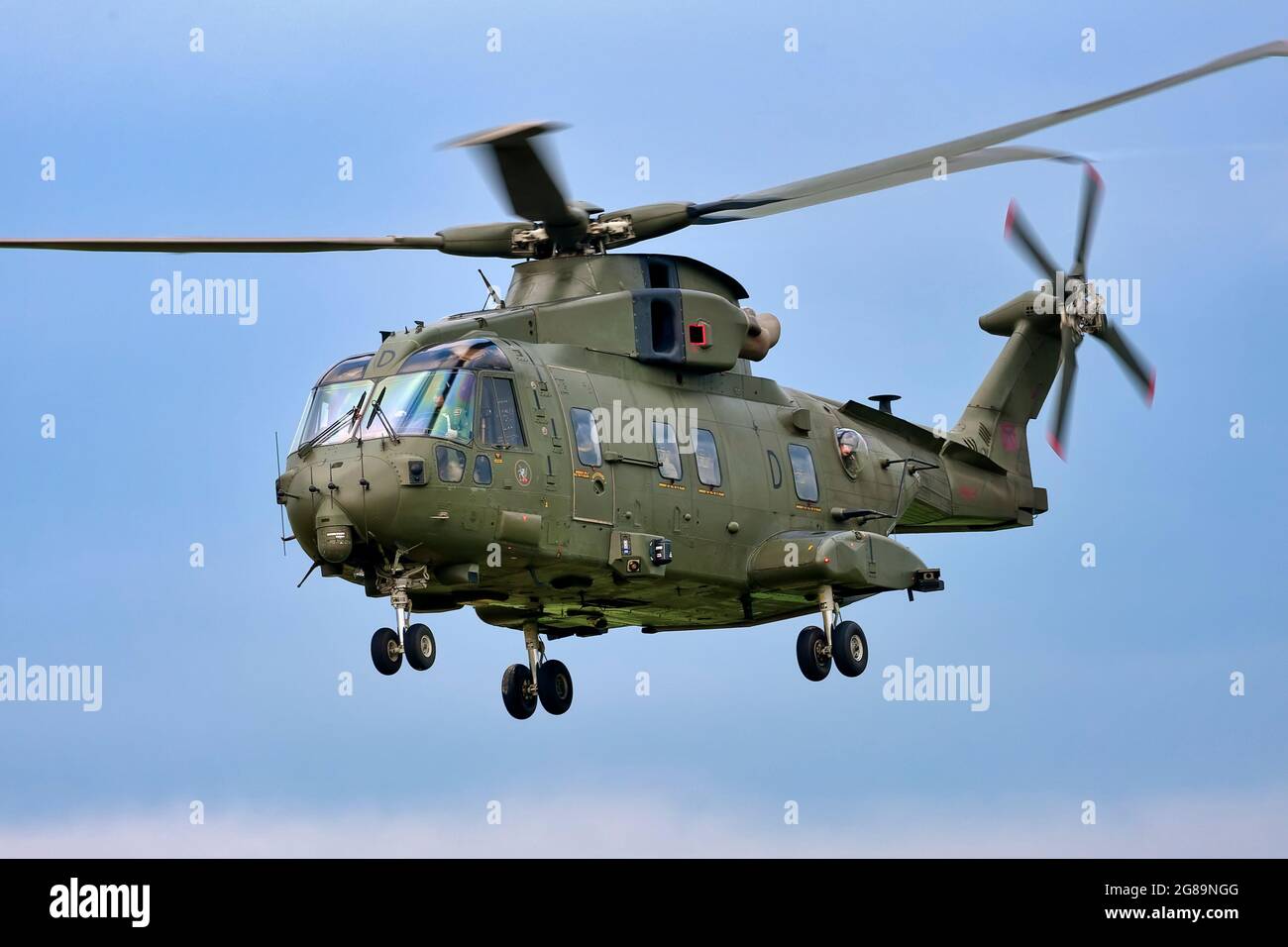 A Royal Air Force AgustaWestland Merlin HC.3 helicopter,  CN 50083, ZJ120, flies over the Salisbury Plain Training Area in Wiltshire, England, UK Stock Photo