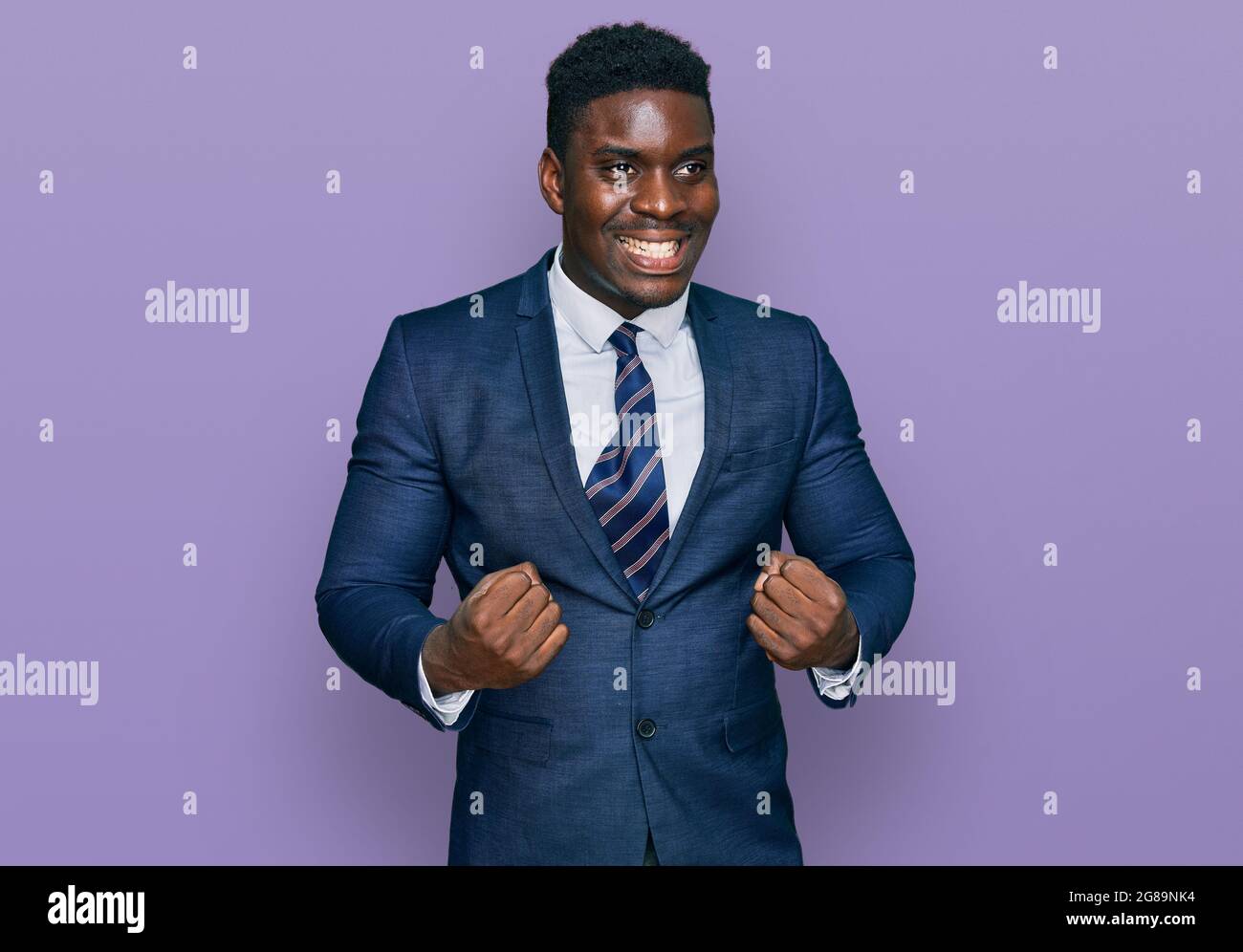 Handsome business black man wearing business suit and tie excited for ...