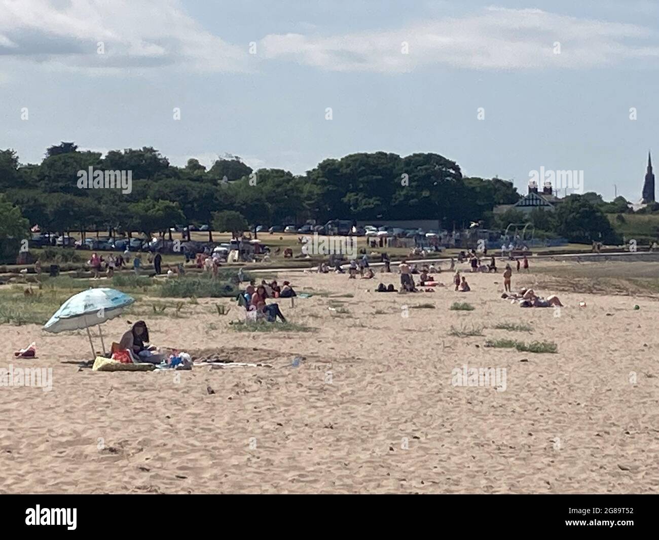 Sun bathers enjoy the July heat wave at the beach in Seapark in ...