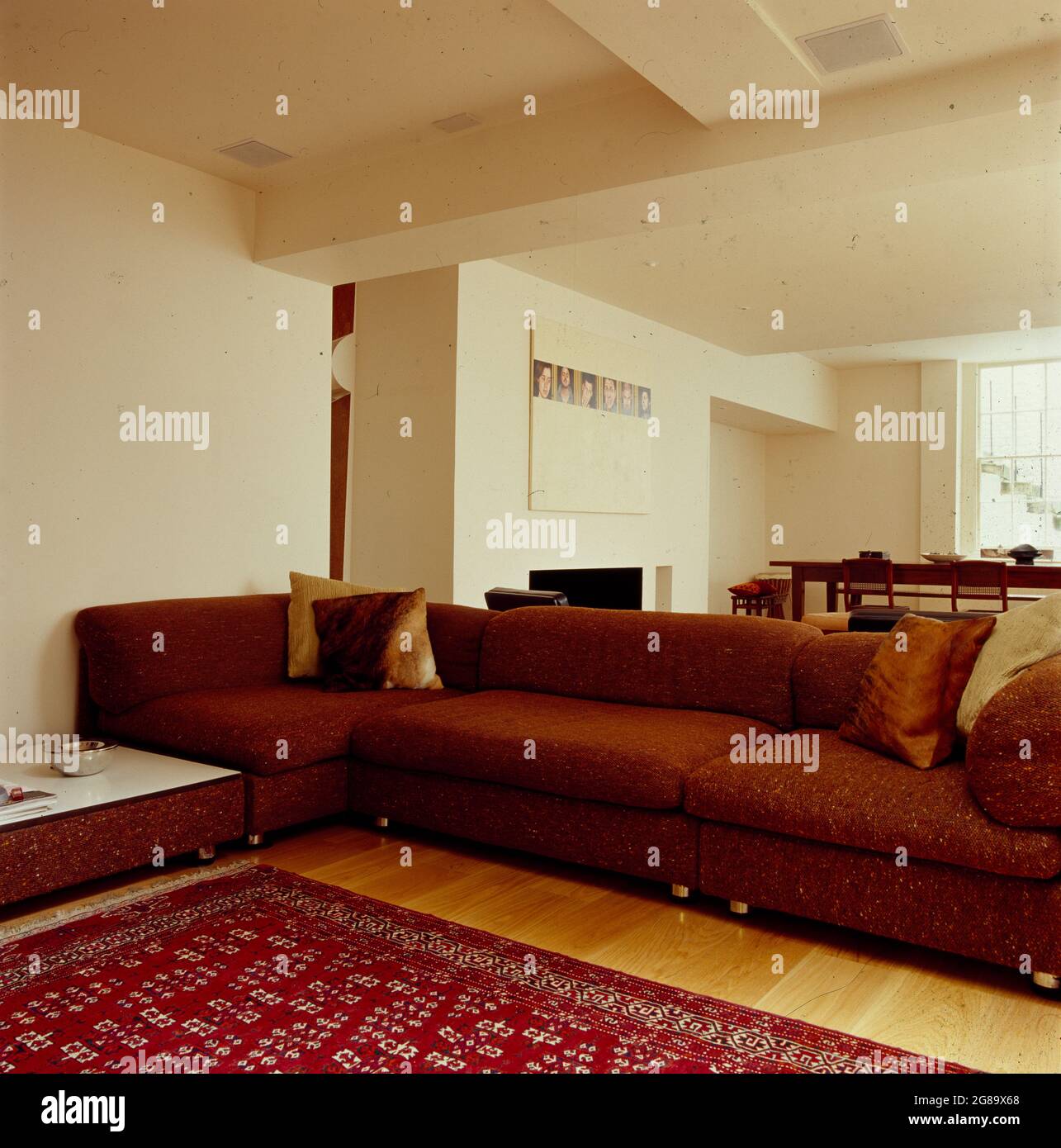 Brown corner sofa in modern white living room Stock Photo Alamy