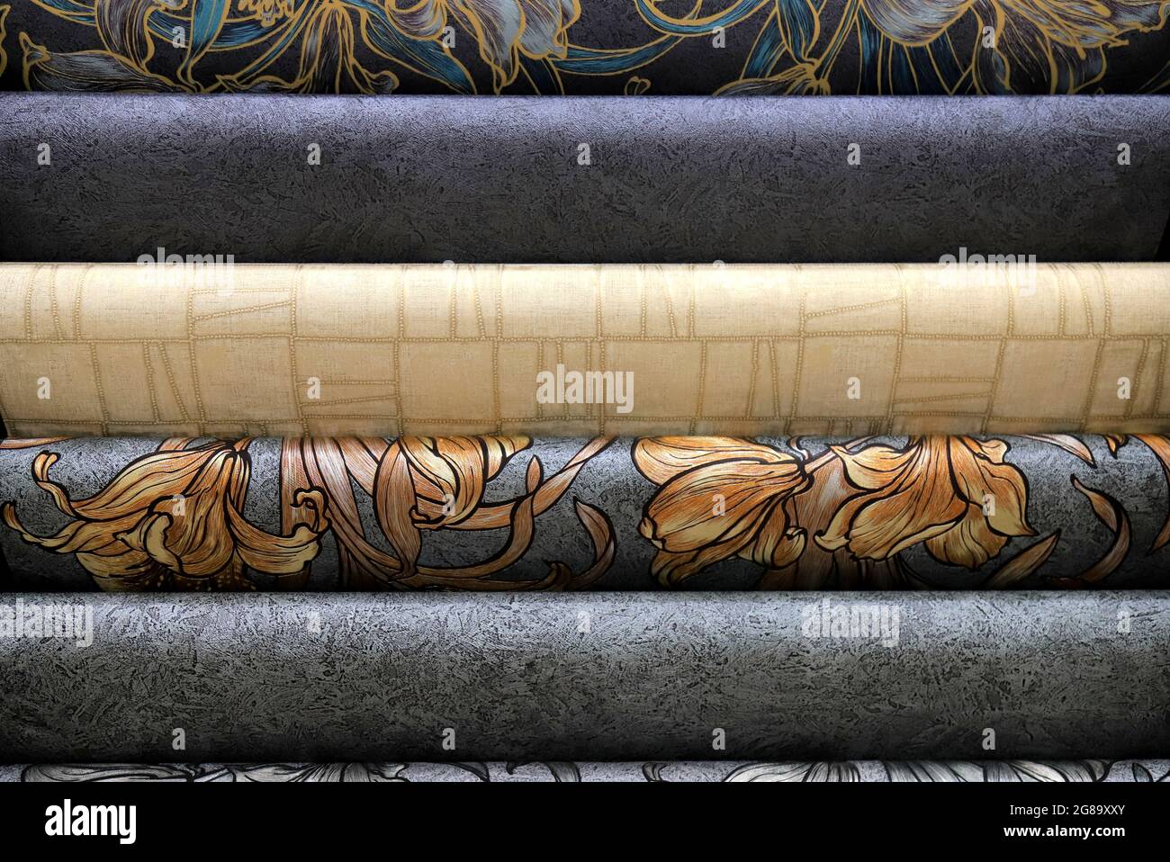 Rolls of vinyl wallpaper. Various textures and colors of paper for wall