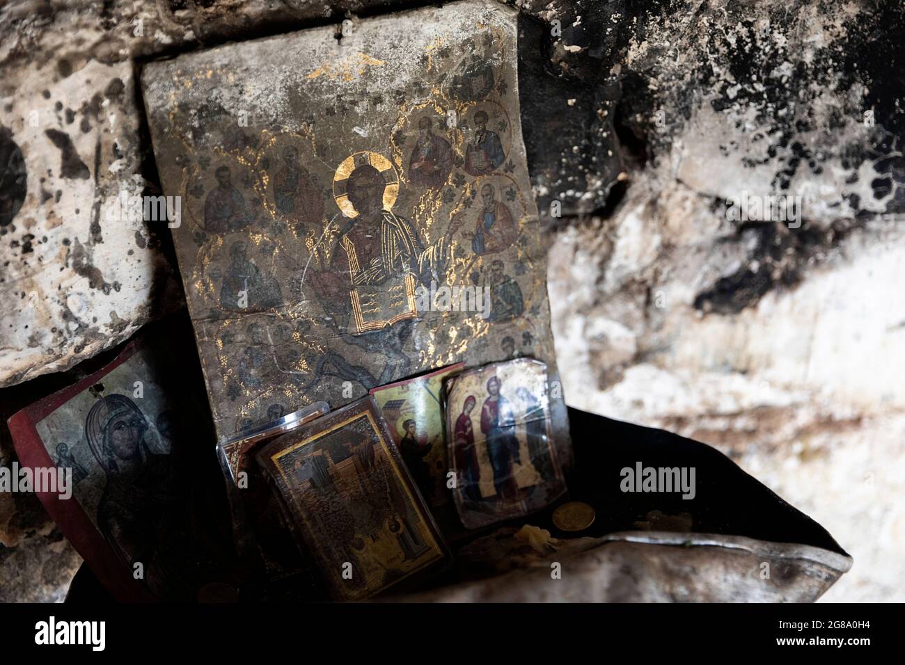 Inside a bunker, decorated with orthodox icons, Lin, Albania Stock Photo