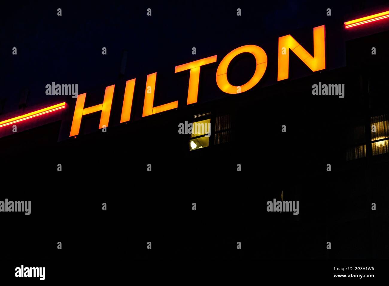 Night view of the Hilton logo on a sign on the Hilton at Chicago's O'Hare Airport, USA. Stock Photo