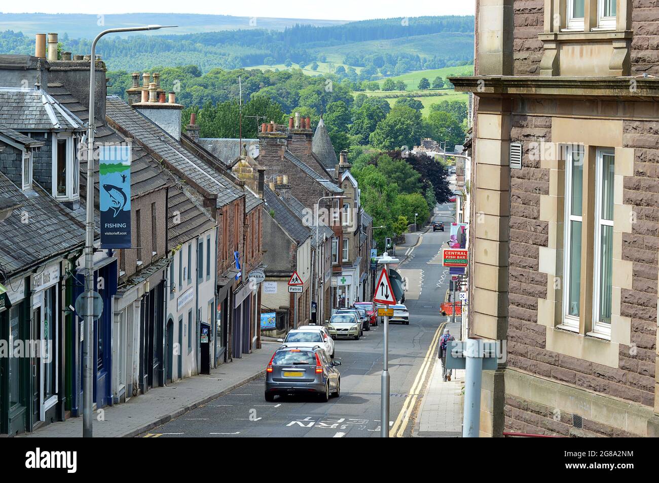 CRIEFF, PERTHSHIRE, SCOTLAND - 21 JUNE 2021: A view down King Street in Crieff, Perthshire, Scotland, past the solid sandstone Burgh Chambers Stock Photo