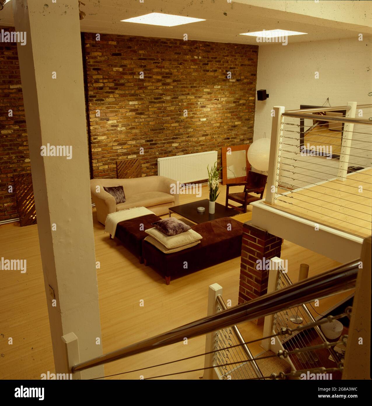 Birdseye view of loft conversion living room with exposed brick wall ... - Loft Conversions With Exposed Bricks