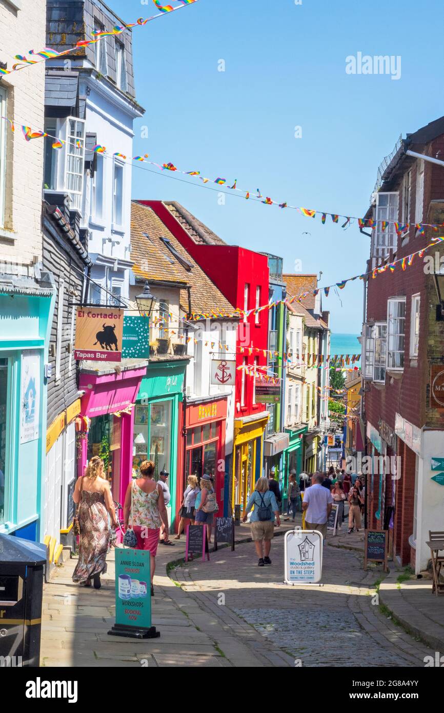 Folkestone, colourful shops and cafes line the steep and cobbled Old High Street, in the Creative Quarter, Kent, UK Stock Photo