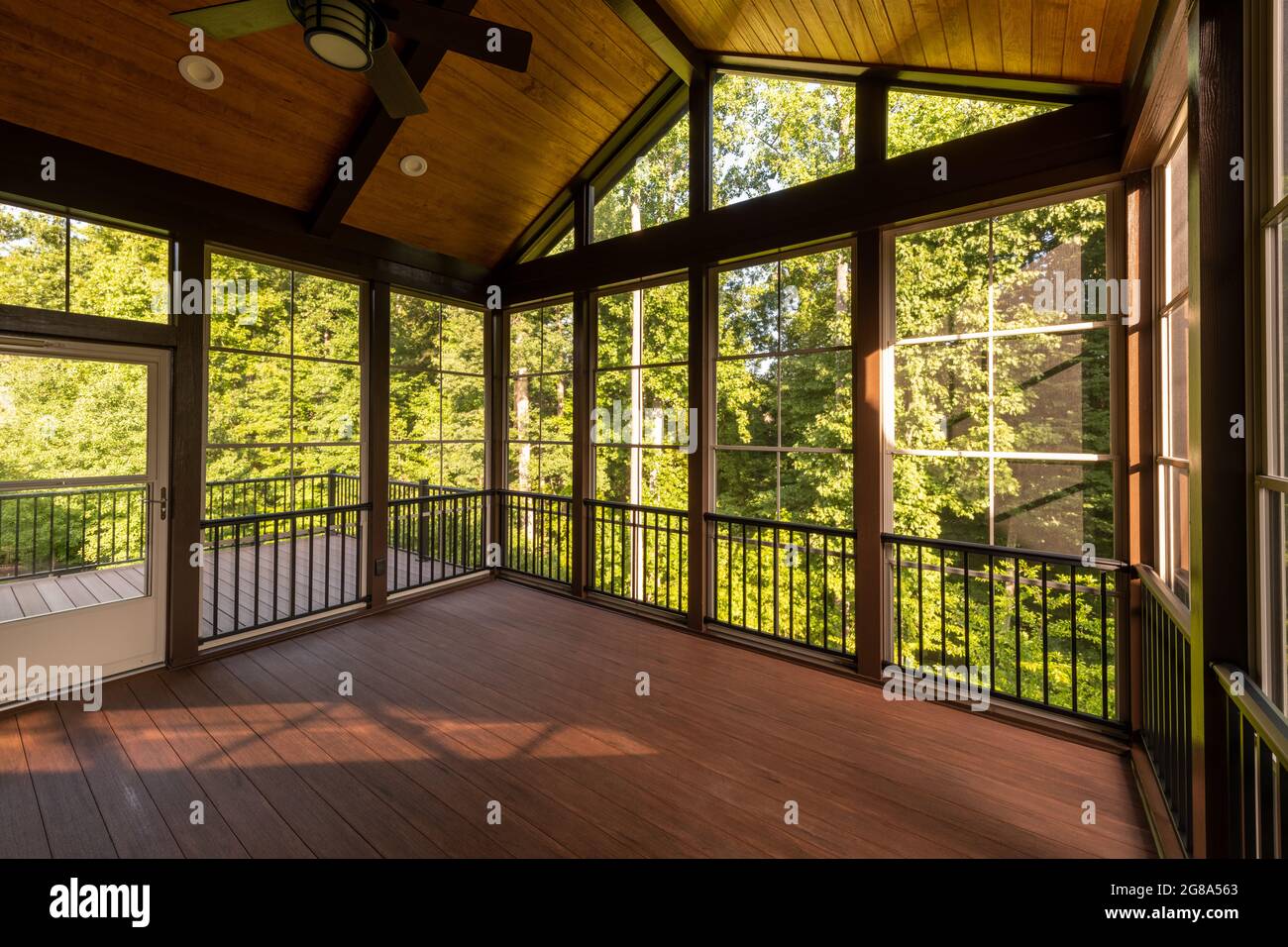Modern screened porch with plastic windows and composite floor with