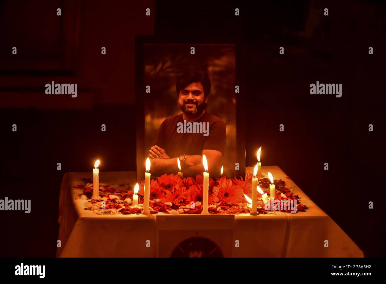 Srinagar, India. 18th July, 2021. Candles are placed by Kashmiri