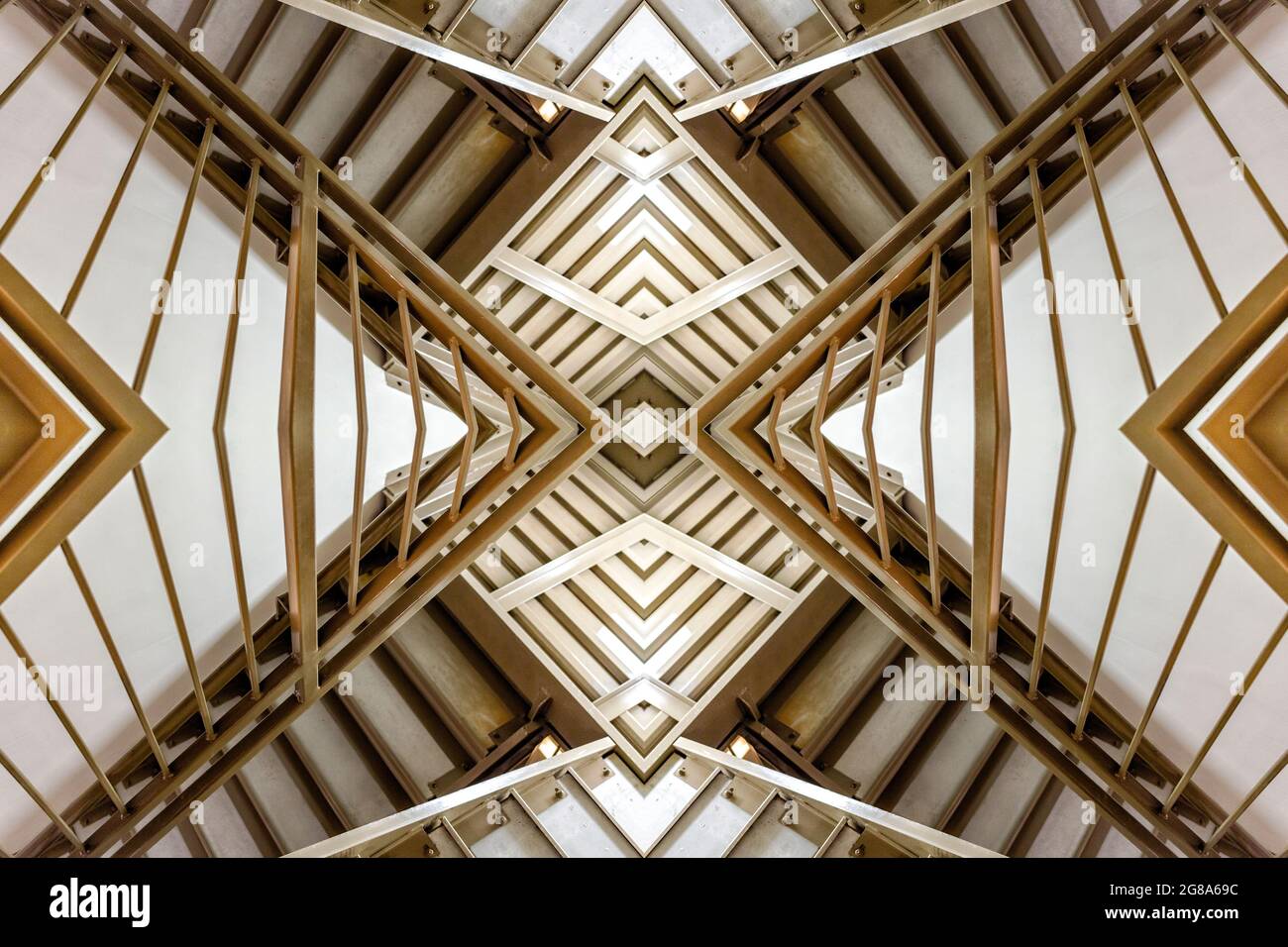 An image of a stair case, steps and railing is turned into an abstract geometric design through duplication, replication, and composite photography. Stock Photo
