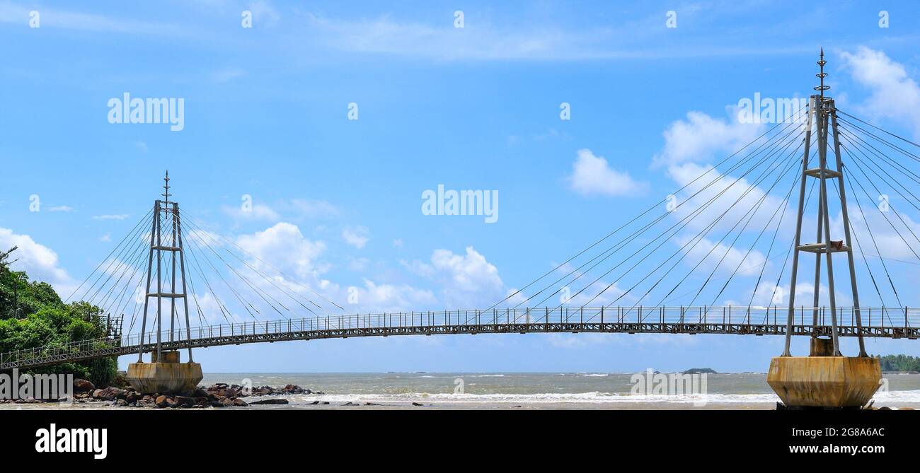 Bridge to the island with a Buddhist temple, Matara, Sri Lanka. Wide ...