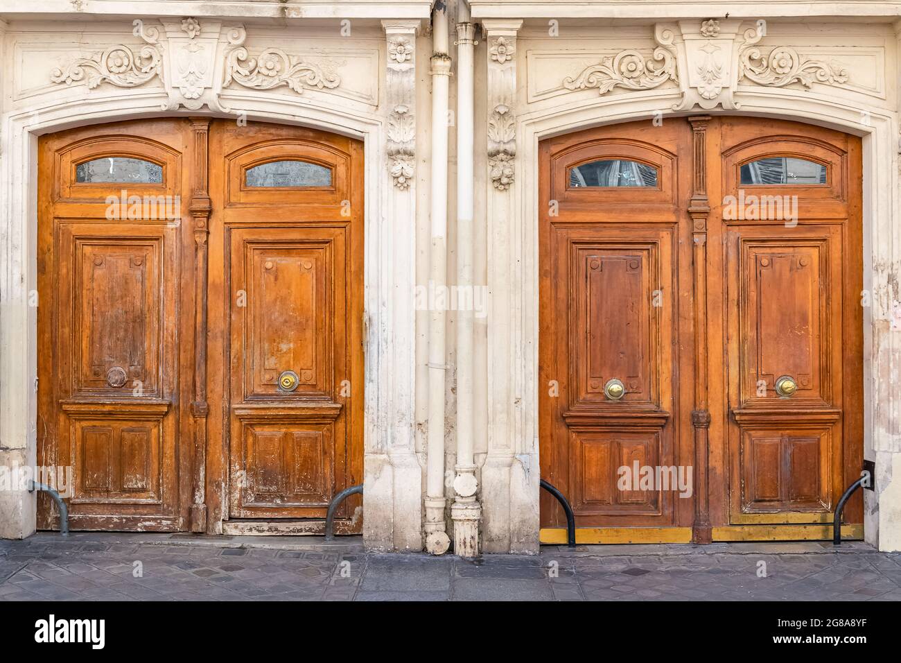 Paris, two ancient wooden doors, typical buildings in the 10e arrondissement, rue de Marseille Stock Photo