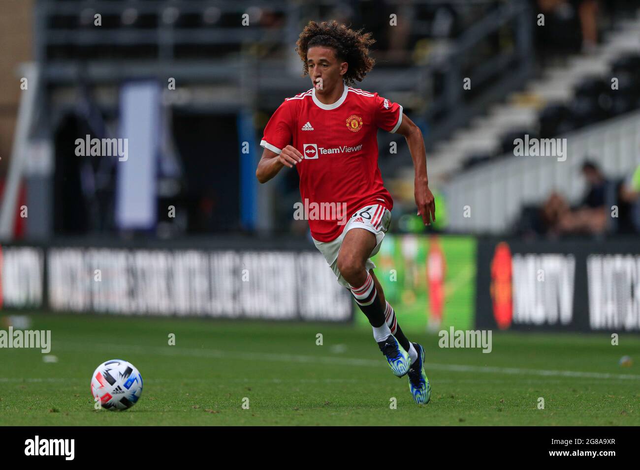 Hannibal Mejbri #46 of Manchester United runs with the ball Stock Photo