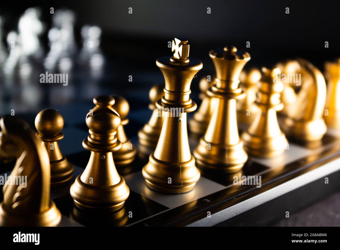 Chess pieces in starting position on a wooden Board Stock Photo by  ©Rostislavv 141335034