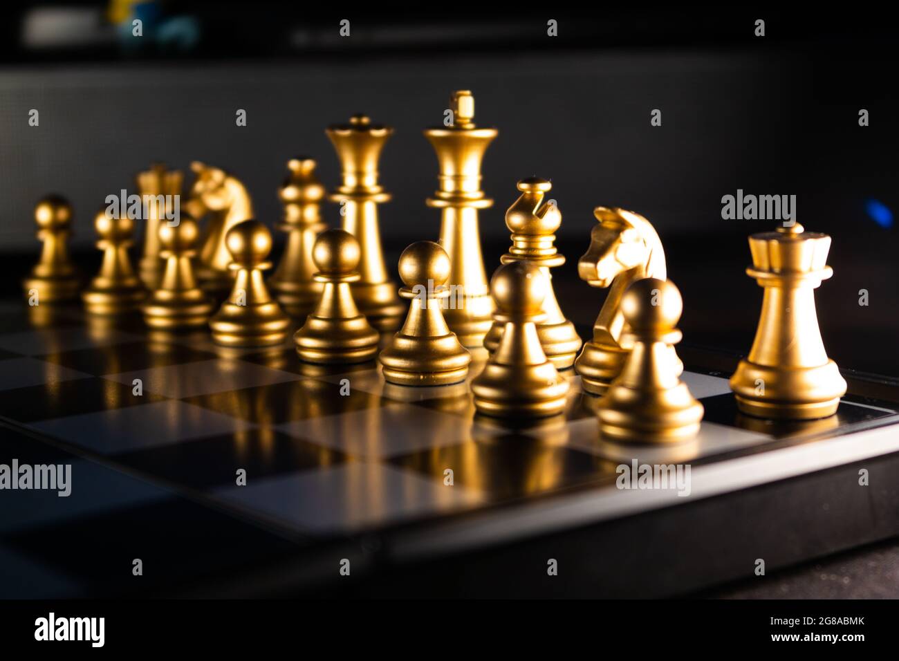 Horizontal shot of cool silver chess pieces in the starting position  reflected on the board Stock Photo by wirestock