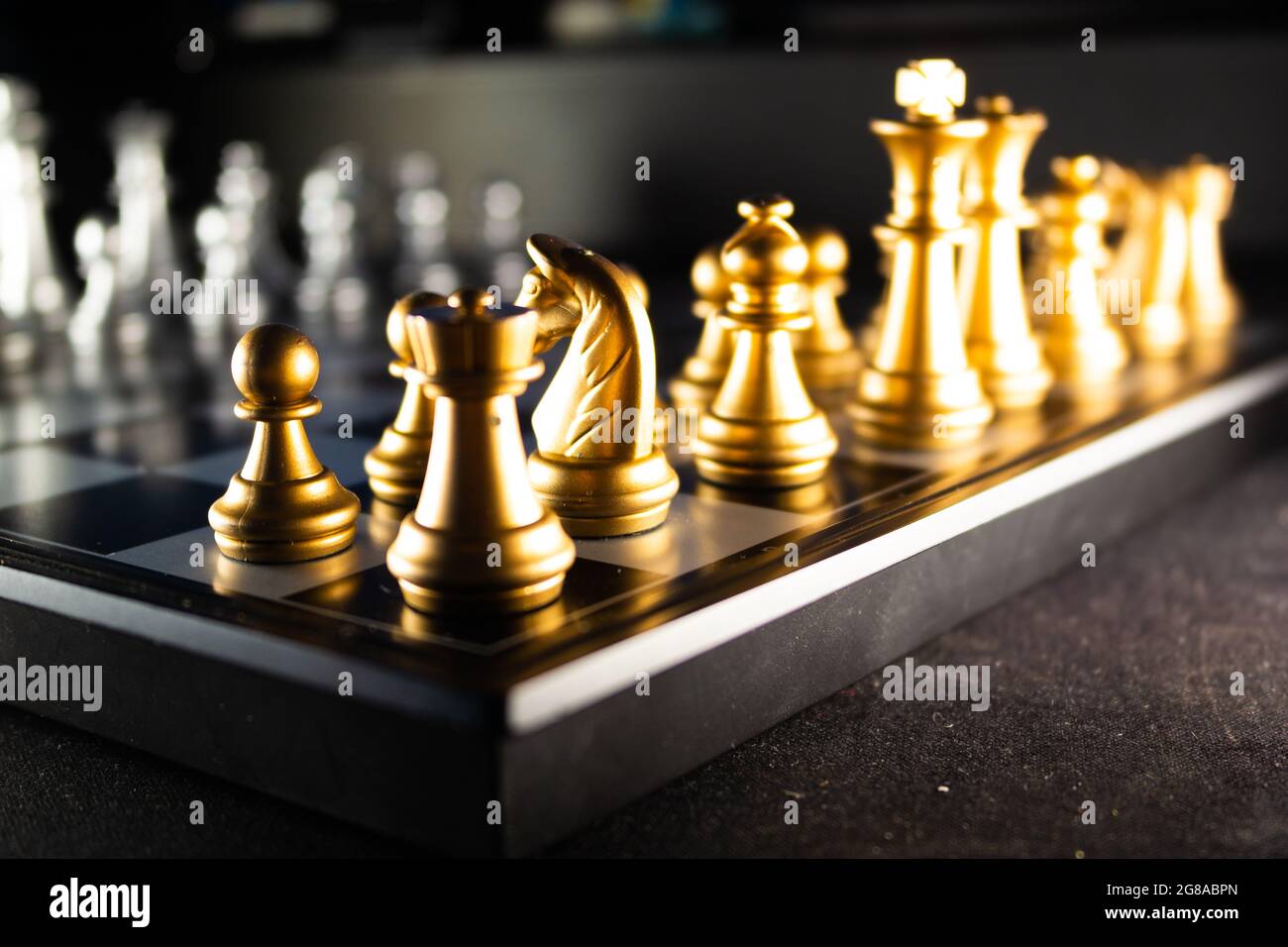 Chess pieces in starting position on a wooden Board Stock Photo by  ©Rostislavv 141334490