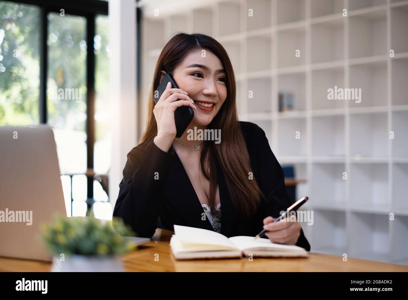 Agent sales manager vehicle insurance makes contact with her customer. Saving and Insurance concept. Stock Photo