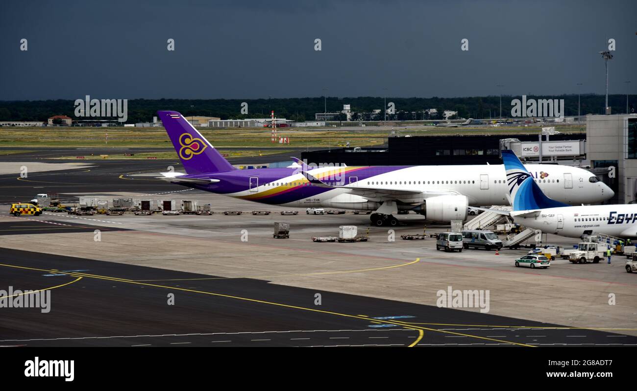 Sunday, 4 July 2021, 13:46:38. Thai Airways passenger Aeroplane docked at the terminal of Frankfurt  Airport Germany Stock Photo