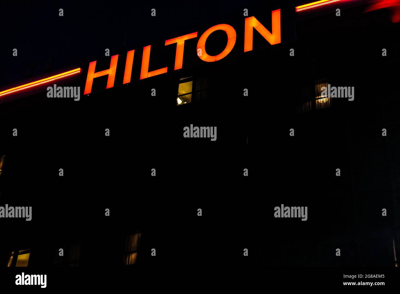Night view of the Hilton logo on a sign on the Hilton at Chicago's O'Hare Airport, USA. Stock Photo
