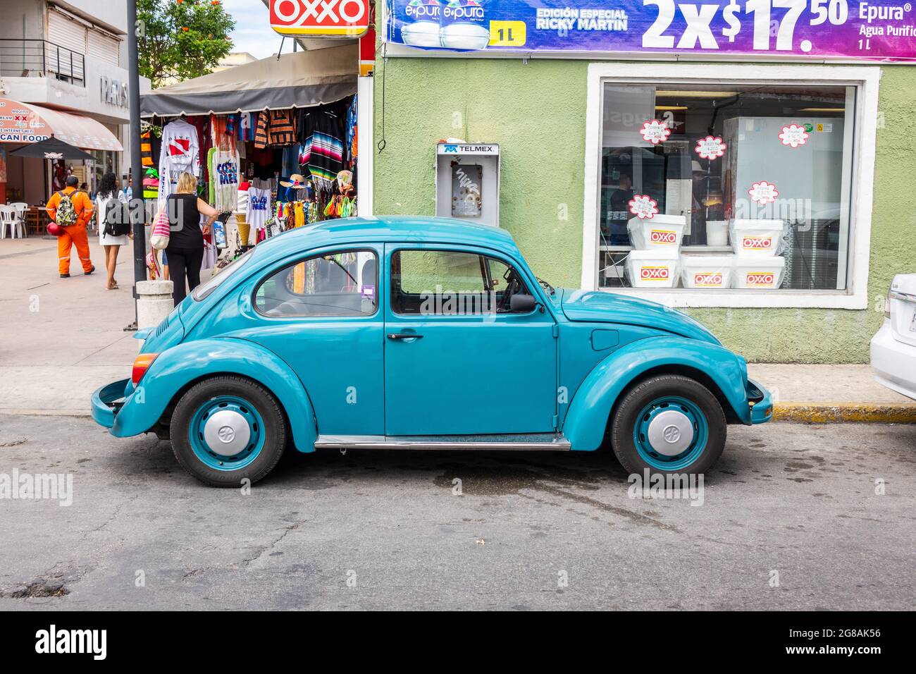 Blue Classic Vintage Original Volkswagen Beetle In Cozumel Mexico Parked On A City Street, Known As A Volkswagen Bug In The U.S. Stock Photo
