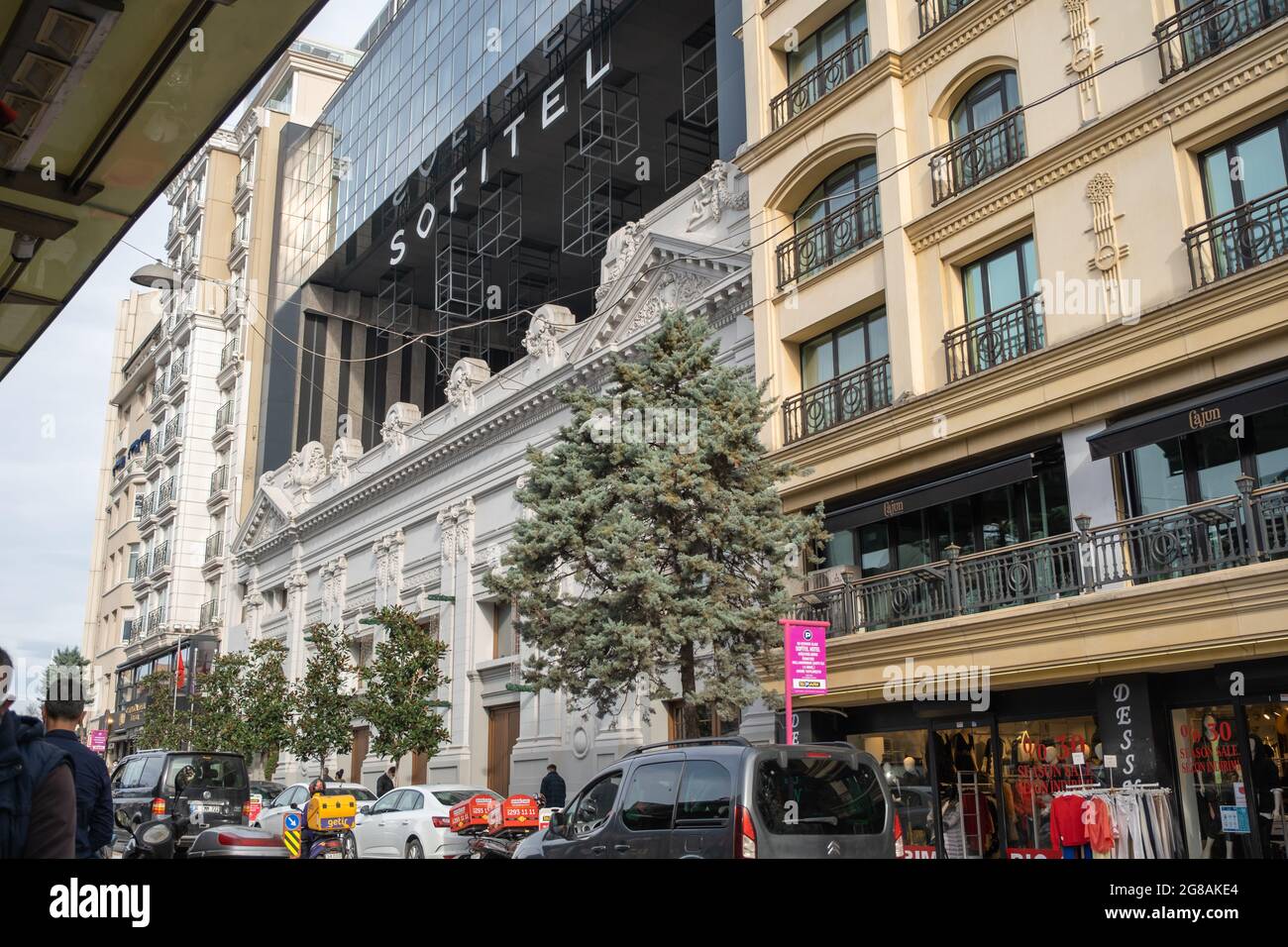 Beyoglu, Istanbul, Turkey - 02.17.2021: Sofitel Istanbul Hotel building and Cajun Brasserie Cafe in the entrance of Istiklal Avenue in Taksim Stock Photo
