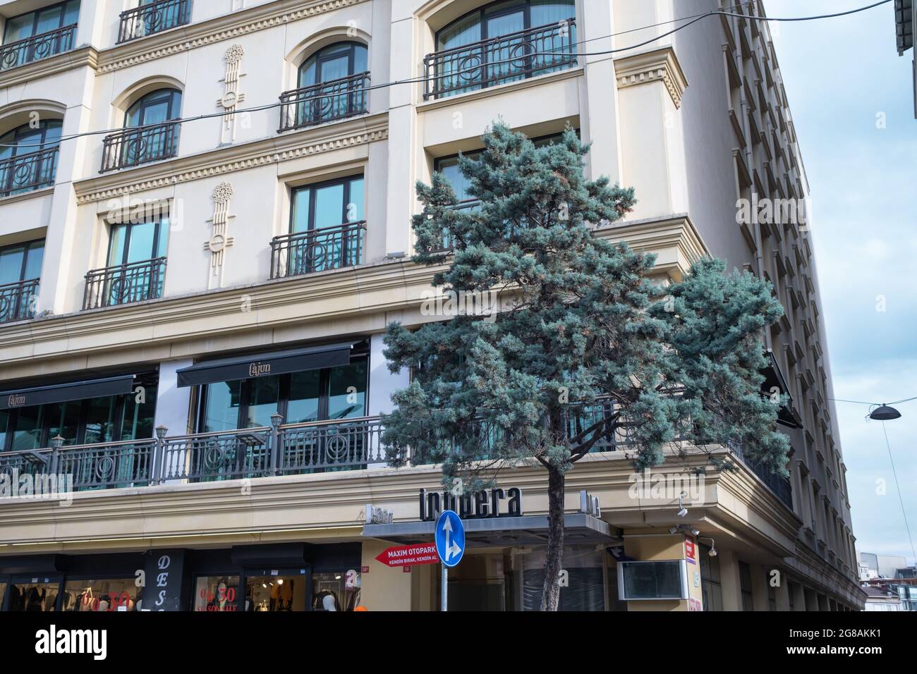 Beyoglu, Istanbul, Turkey - 02.17.2021: Innpera Hotel building and and Cajun Brasserie Cafe at the beginning of Istiklal Street Stock Photo