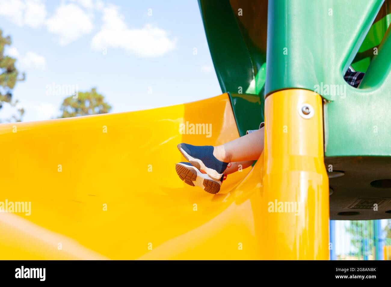 Modern colorful kids playground swings, slides, steps and ladders