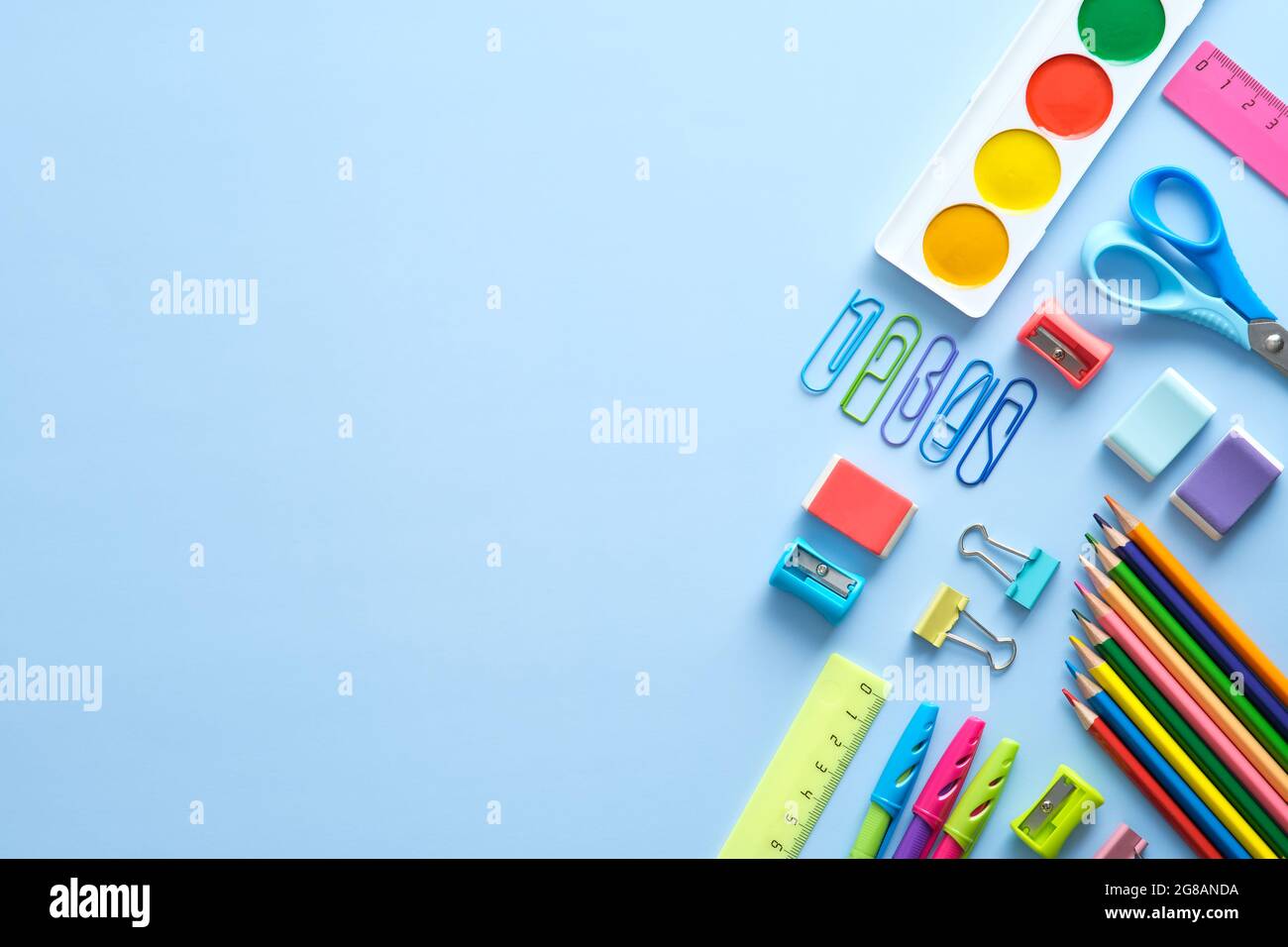 Back to school background with school supplies on blue desk. Flat lay ...