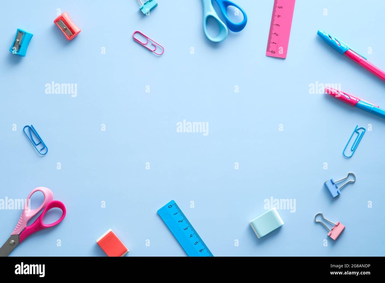 Frame made of school supplies on blue background. Back to school ...