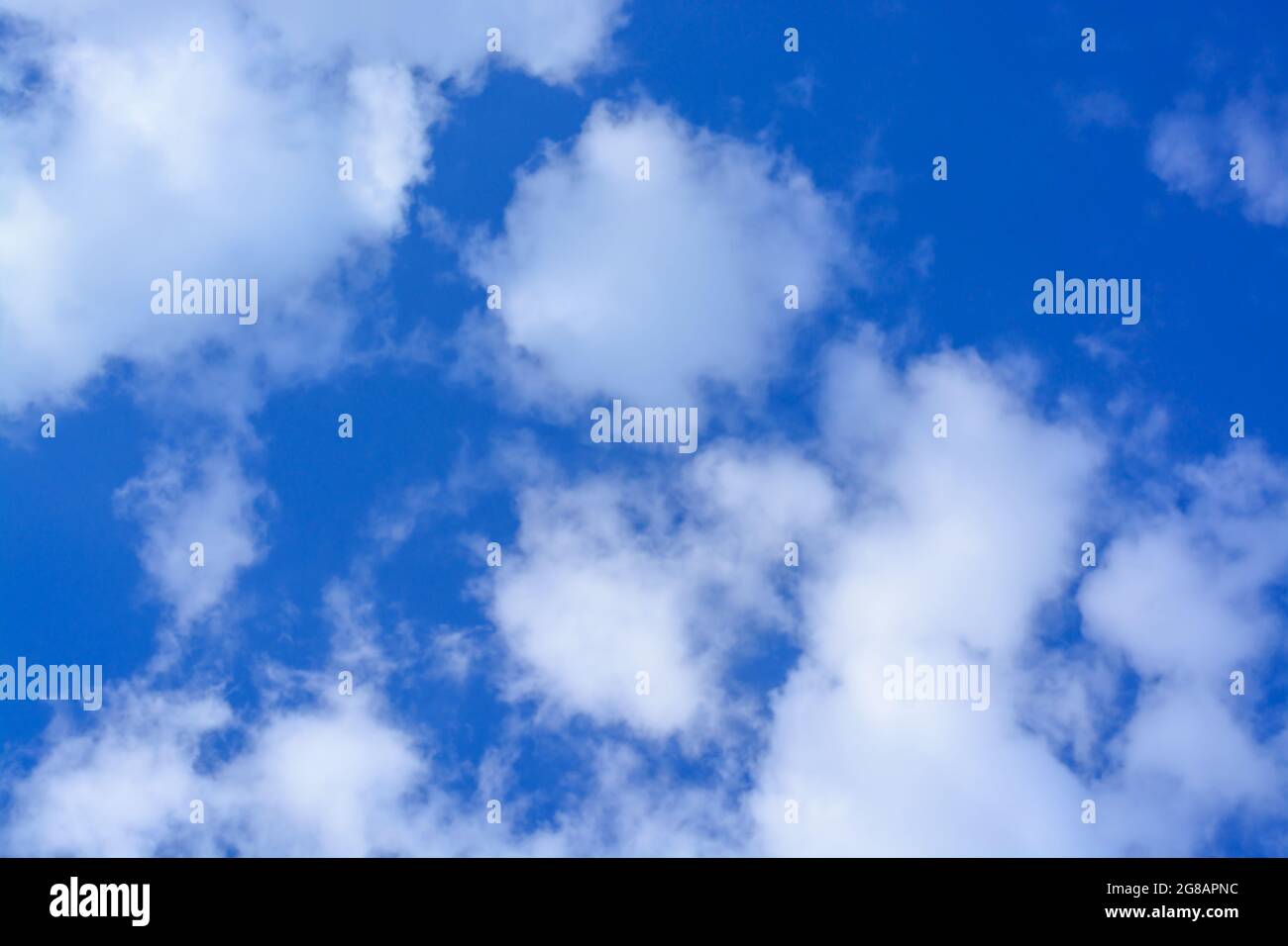 View of a blue sky with small light clouds, horizontal format Stock Photo