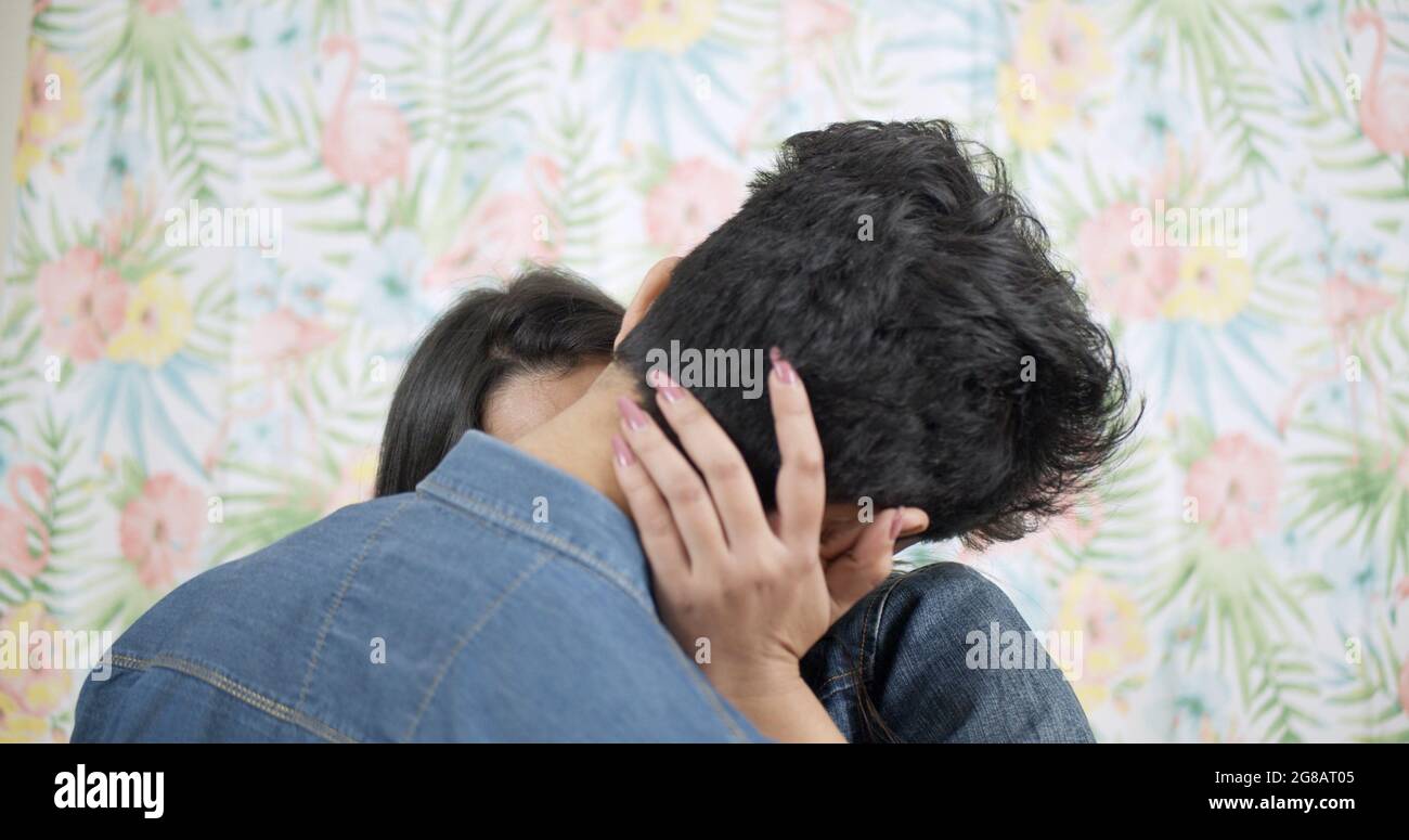 Shallow focus of a young Indian couple kissing Stock Photo - Alamy