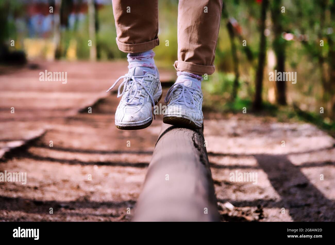 Walking in white tenis over the wooden line Stock Photo