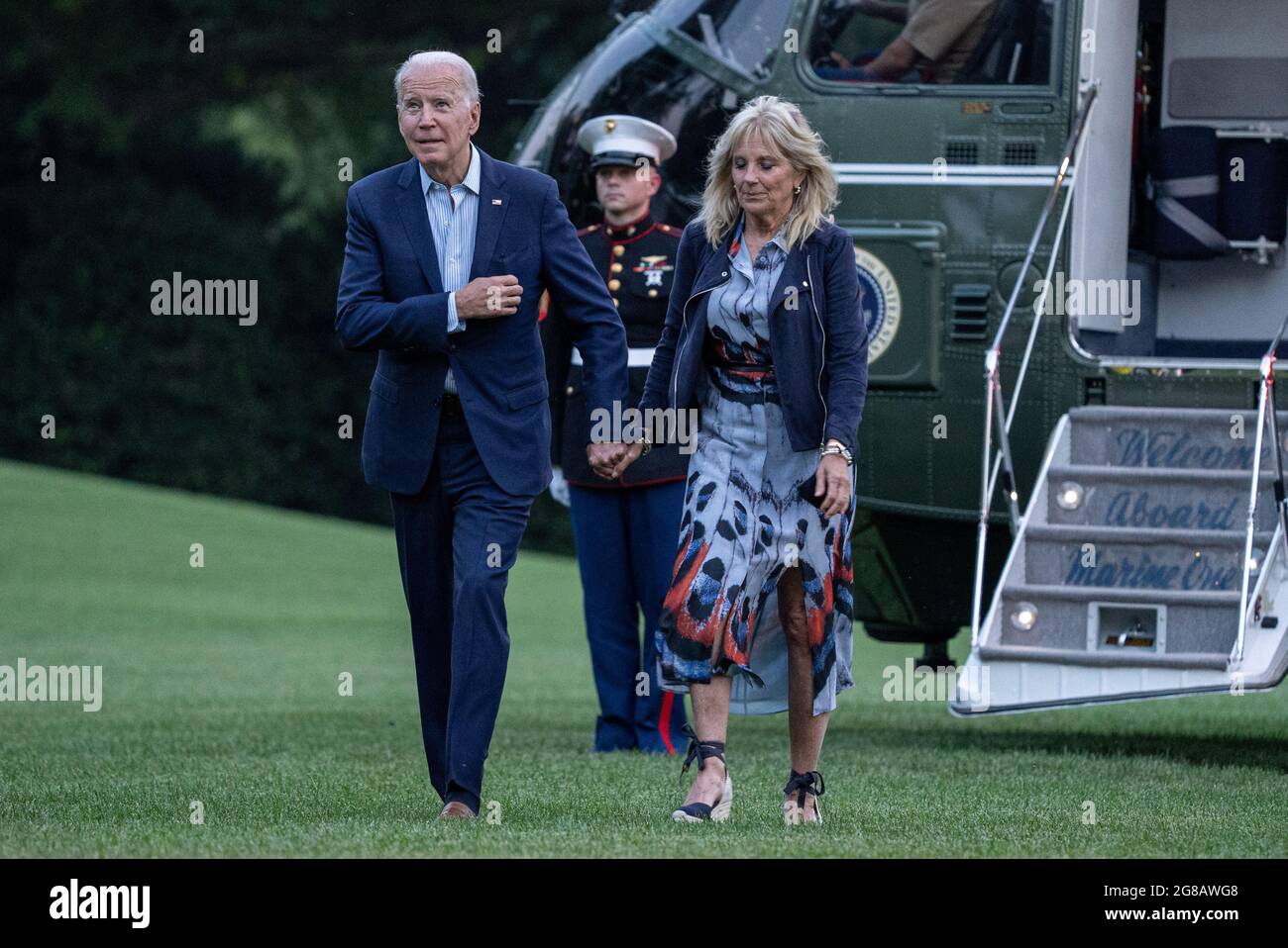 Washington, United States. 18th July, 2021. United States President Joe Biden and First Lady Jill Biden walk off of Marine One on the South Lawn of the White House in Washington, DC on Sunday, July 18, 2021. The Biden's spent the weekend in Camp David. Photo by Ken Cedeno/UPI Credit: UPI/Alamy Live News Stock Photo