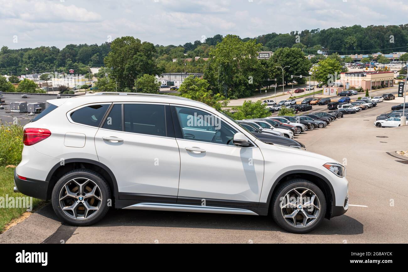 Different colored BMW SUVs lined up downhill at a dealership, Monroeville, Pennsylvania, USA Stock Photo