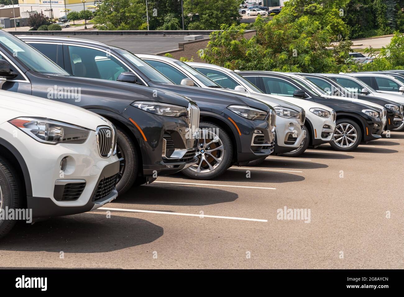 Different colored BMW SUVs lined up downhill at a dealership, Monroeville, Pennsylvania, USA Stock Photo