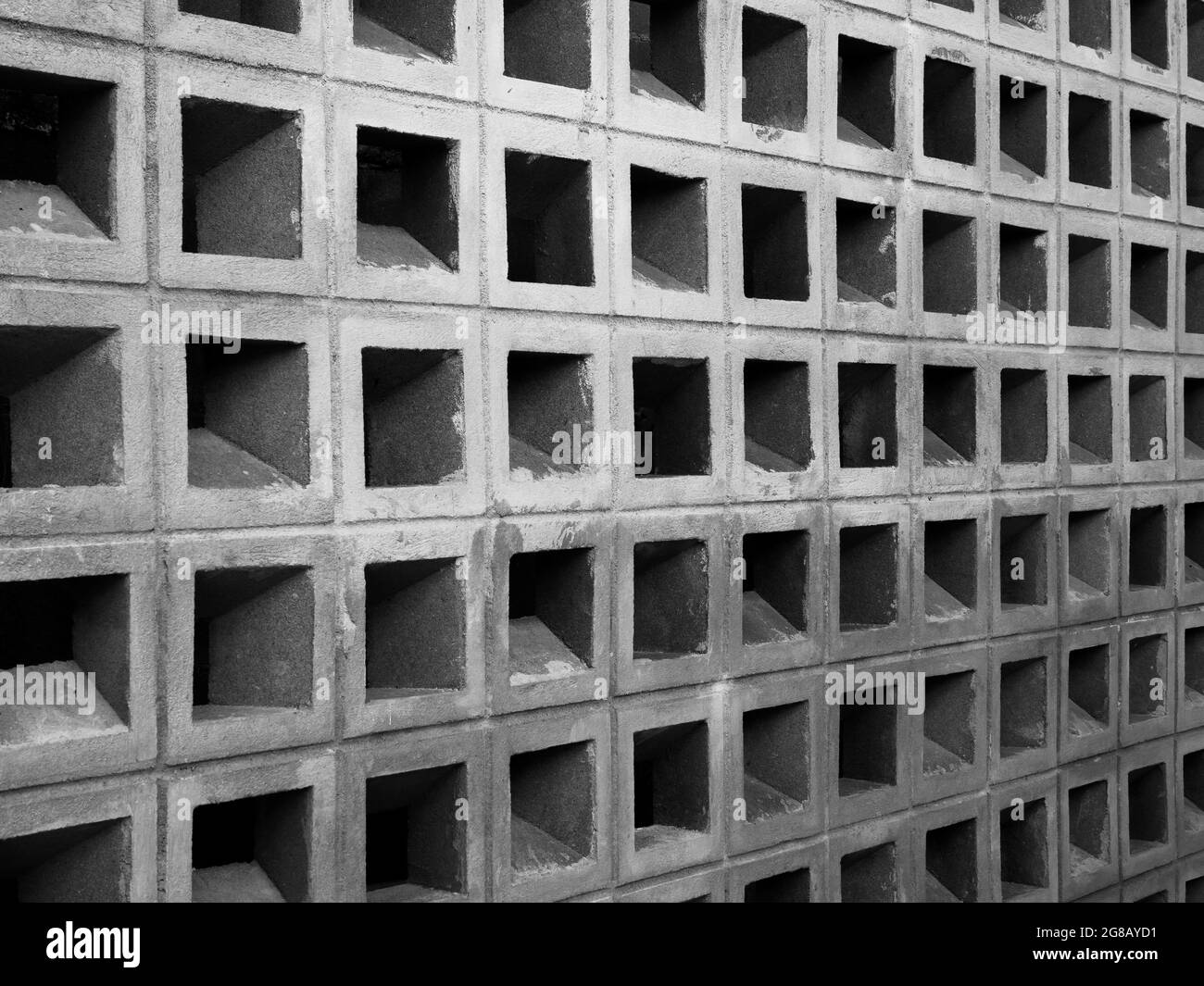 Square concrete block pattern, wall background. Light weight hollow brick block wall structure made from cement. Stock Photo