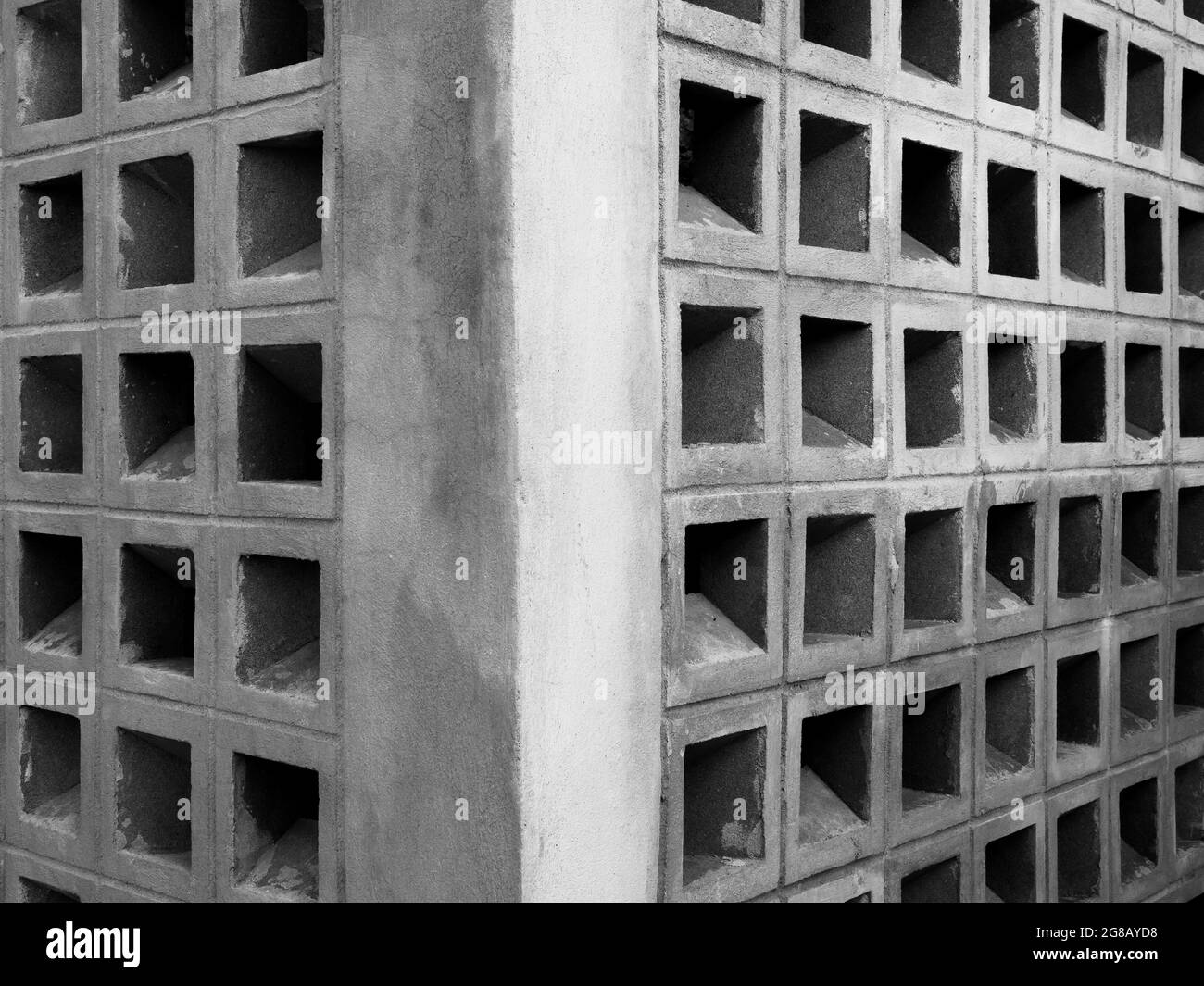 Square concrete block pattern, wall background. Corner of construction wall building, light weight hollow brick block structure made from cement. Stock Photo