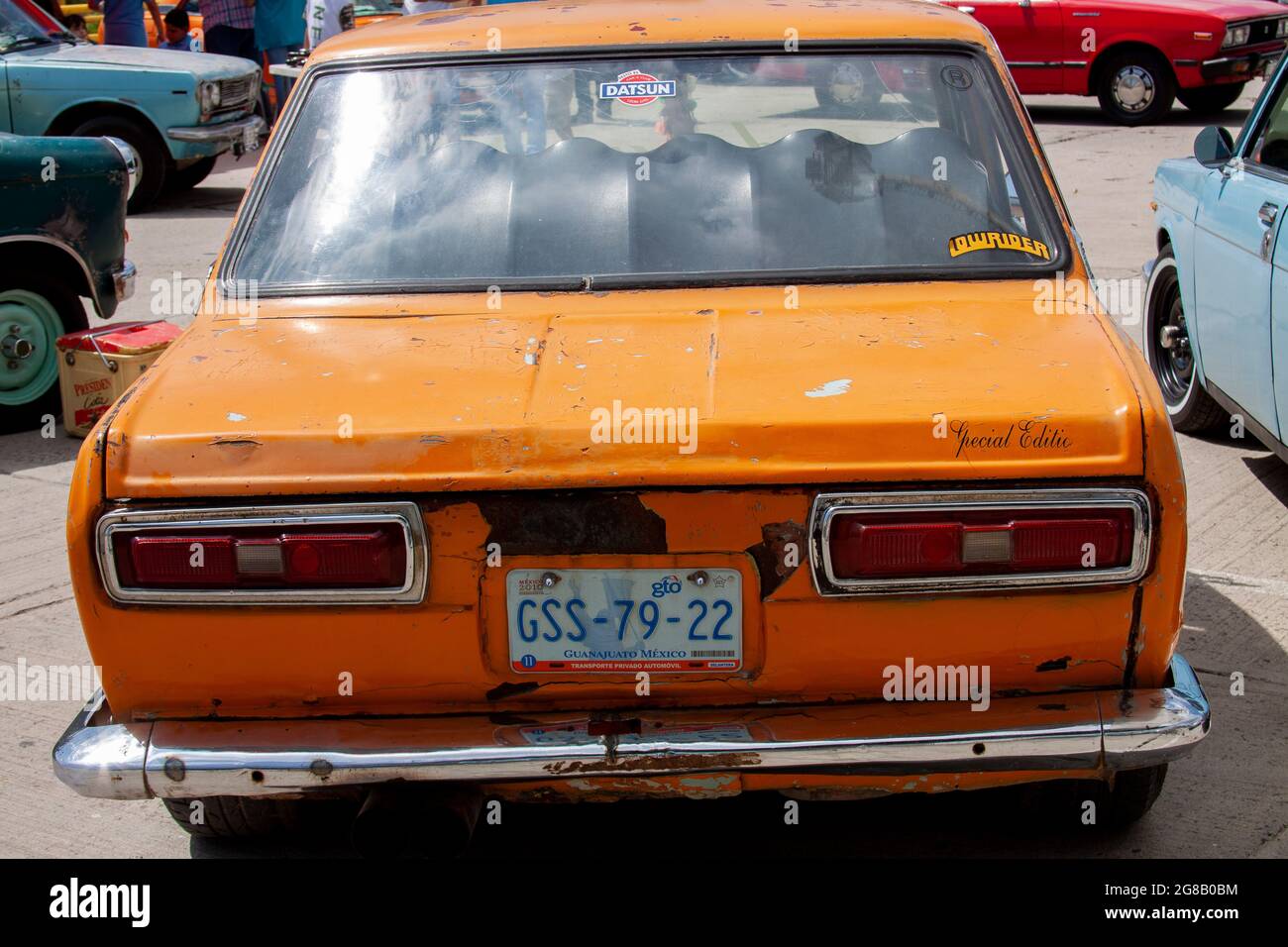 Back of an old Datsun car in the streets of Mexico Stock Photo