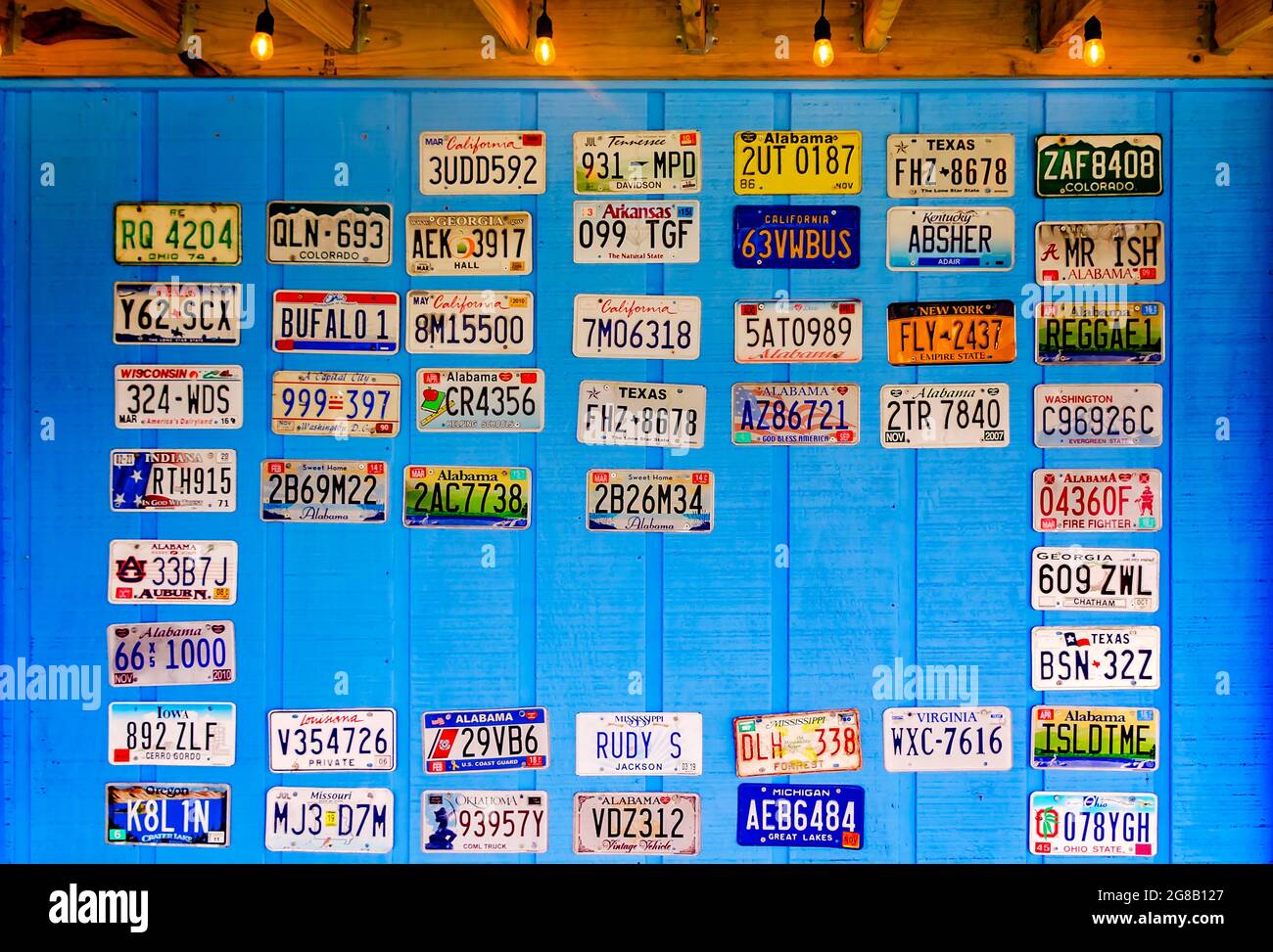 License plates hang on the wall outside Foxy’s Waffle Bar and Sugar Den