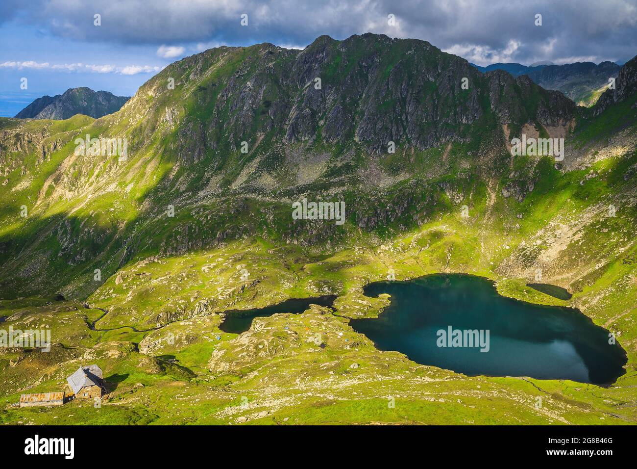Spectacular slopes and valley with beautiful glacier lakes in Fagaras mountains, Lake Podragu, Carpathians, Romania, Europe Stock Photo