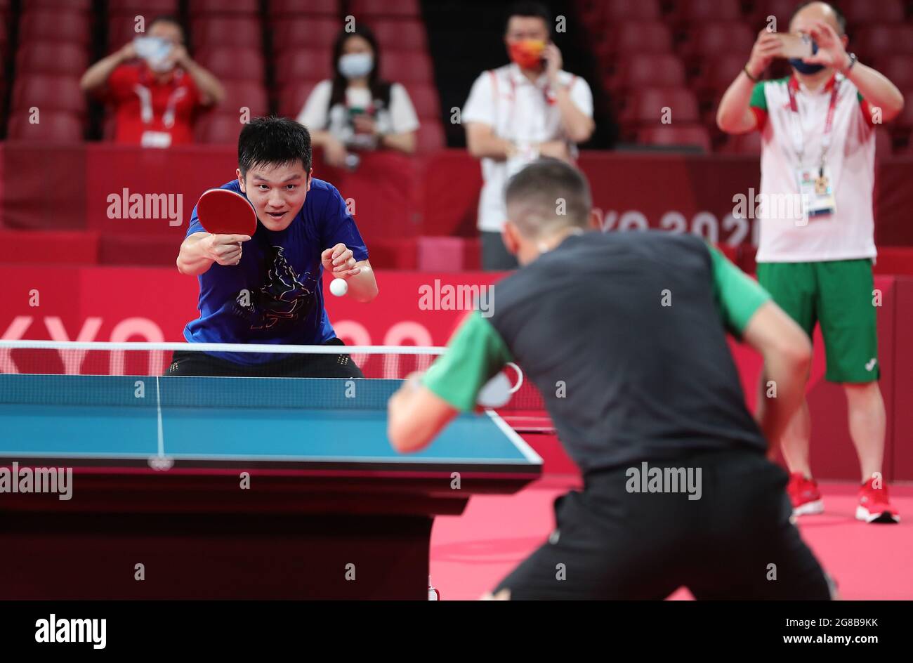 Tokyo, Japan. 19th July, 2021. Chinese table tennis player Fan Zhendong (L)  attends a training session ahead of the Tokyo 2020 Olympic Games in Tokyo,  Japan, July 19, 2021. Credit: Wang Dongzhen/Xinhua/Alamy
