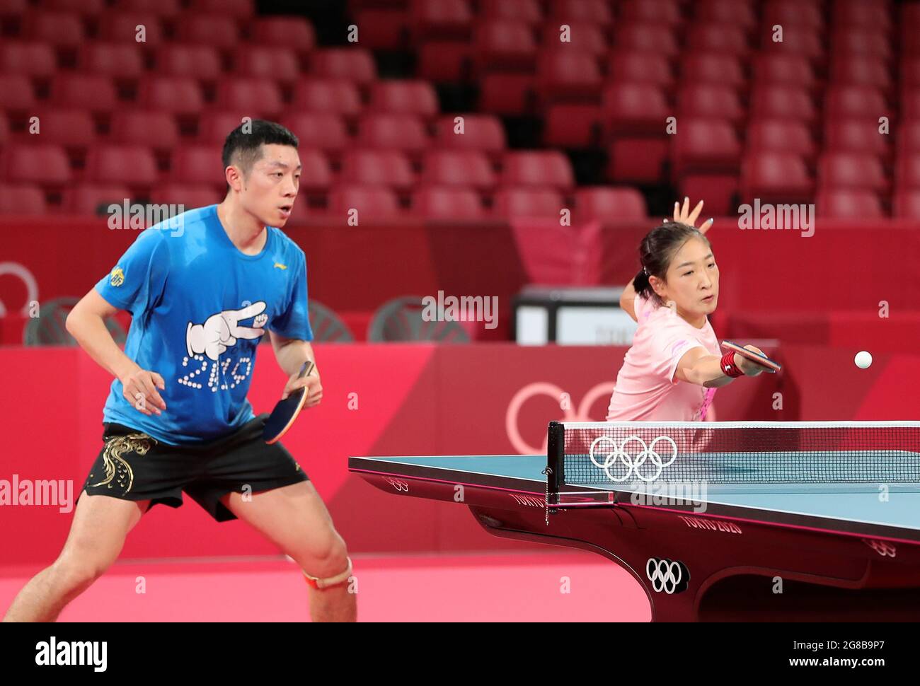 CHINESE TABLE TENNIS PLAYERS LIU GUOLIANG AND KONG LINGHUI RECEIVE MASSAGE  DURING TRAINING SESSION IN SHIJIAZHUANG. Chinese table tennis players Liu  Guoliang (L) and Kong Linghui (R) receive massage during a practice