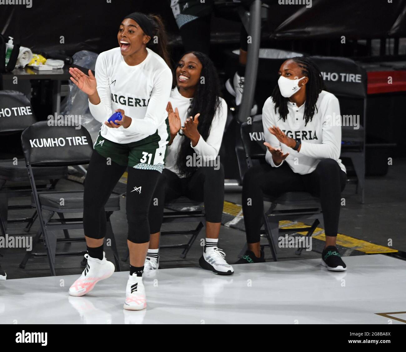 Las Vegas, Nevada, USA. 18th July, 2021. (L-R) Nigerian players and sisters Erica Erinma Ogwumike, Chiney Ogwumike and Nneka Ogwumike applaud their team during a pre-Olympic exhibition basketball game July 18, 2021, in Las Vegas. (Credit Image: © David Becker/ZUMA Press Wire) Stock Photo