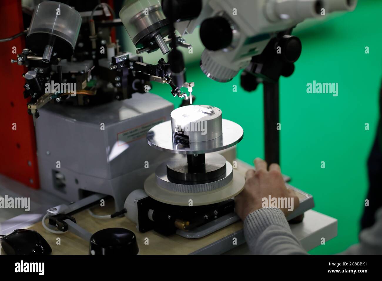 Manual ultrasonic wire wedge bonding machine. Selective focus. Stock Photo