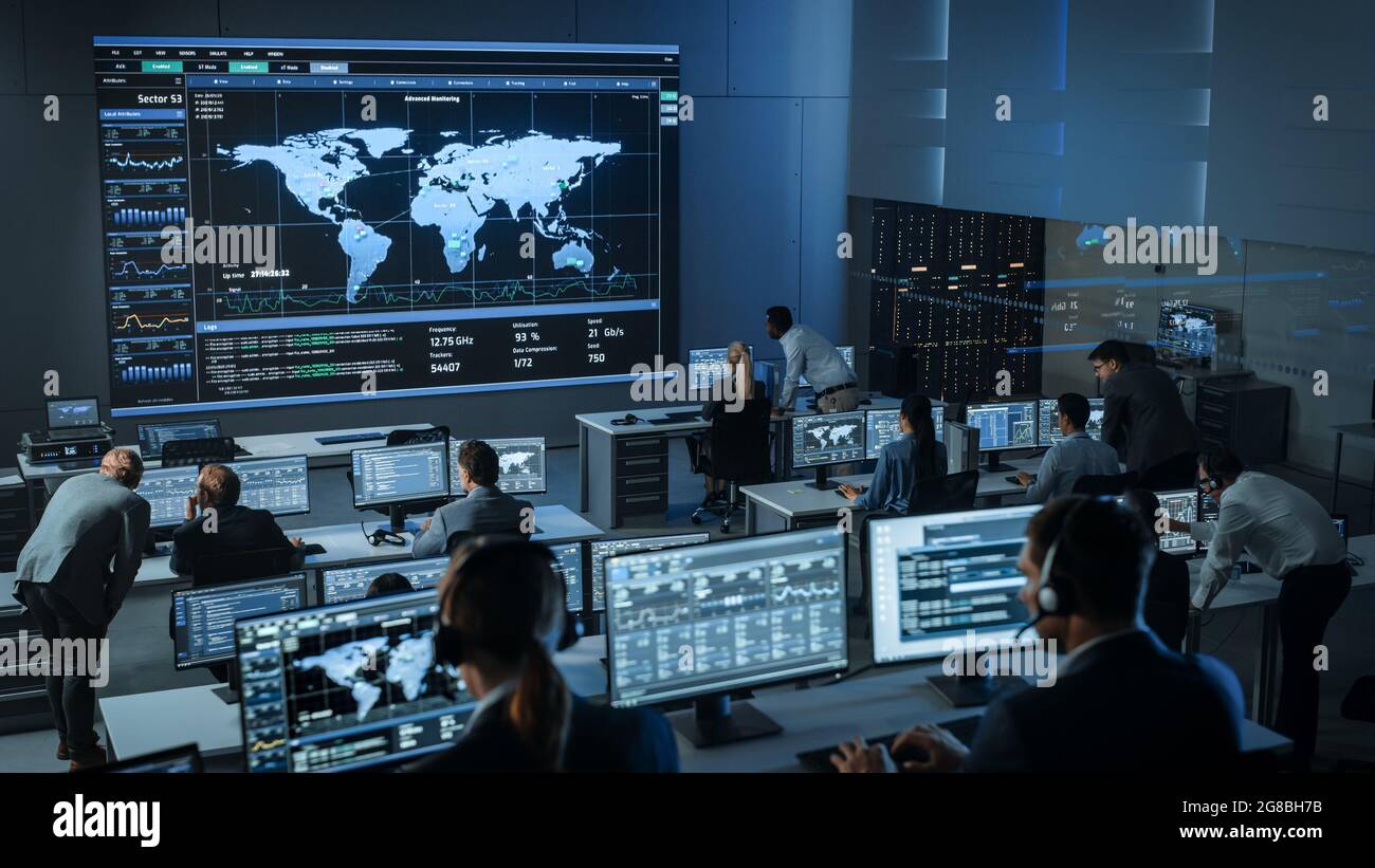 Shot of Officers in a Surveillance Control Center with Police
