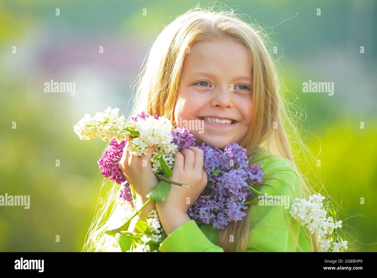 Young spring girl in spring garden. Young lady feeling happy in nature ...