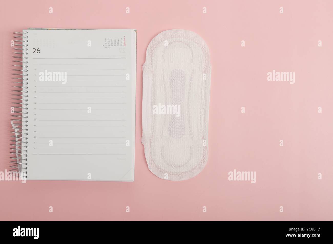 diary with sanitary napkin to know the date of menstrual periods Stock