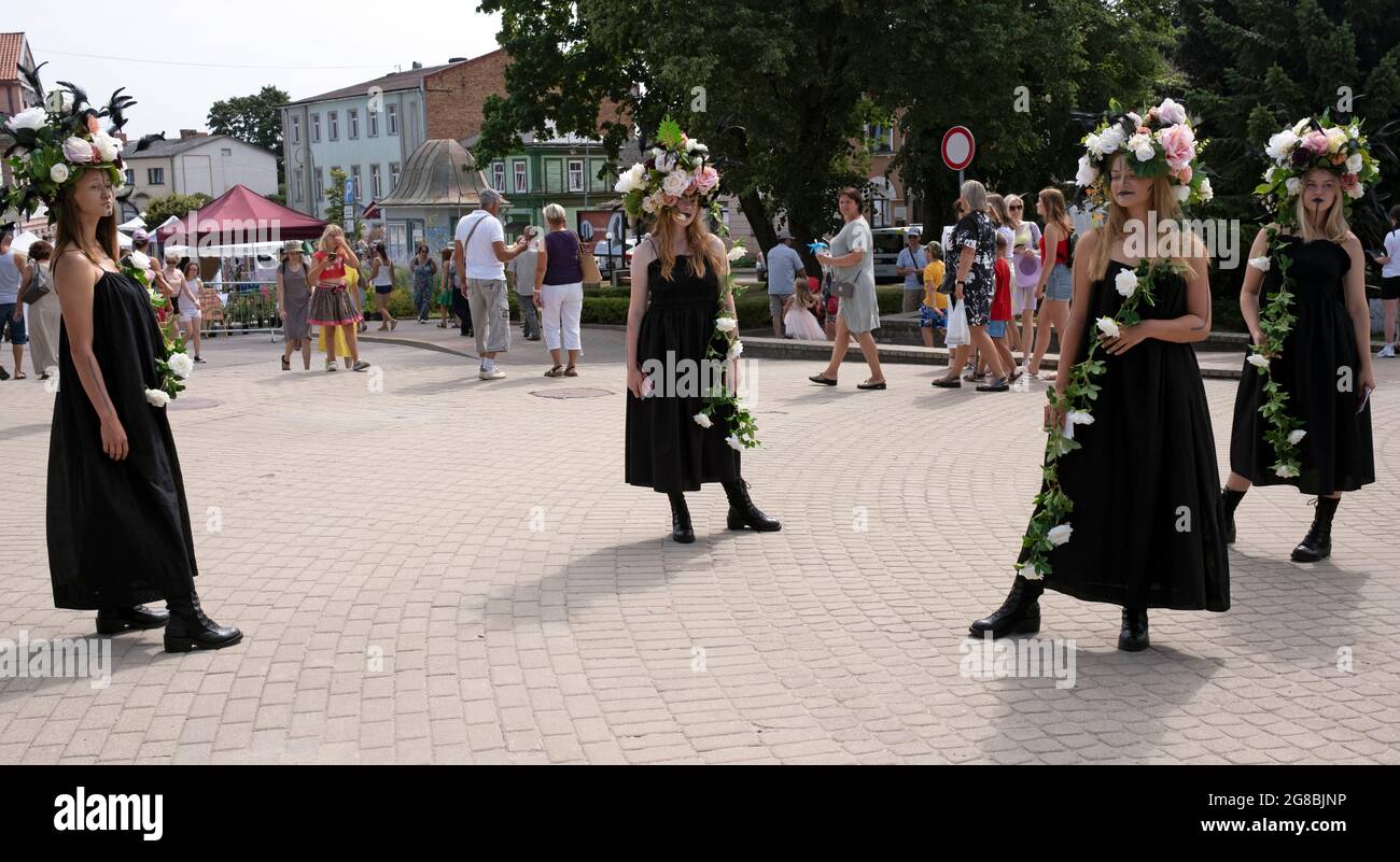 Ladies with Rose Wreaths performing at Festival of Roses in Tukums city Latvia Stock Photo
